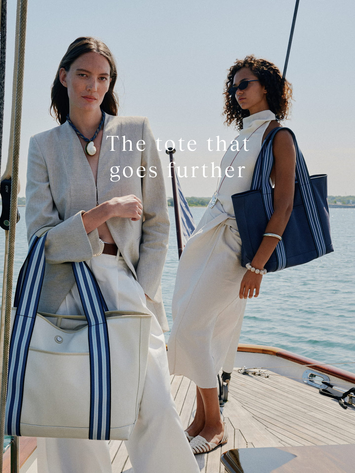 two women standing on a boat