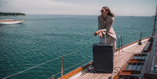 a woman with a suitcase on a boat