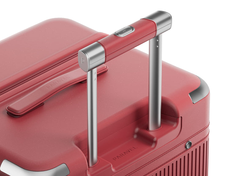 a close up of a red suitcase