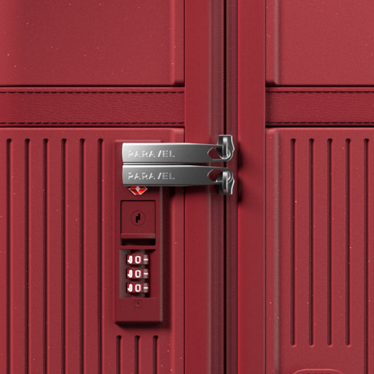 a red suitcase with a lock