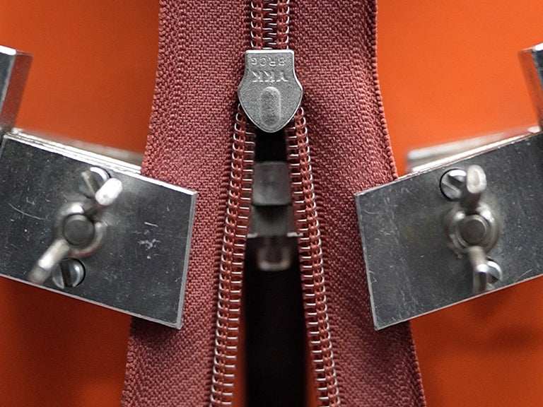 a zipper with metal clasps