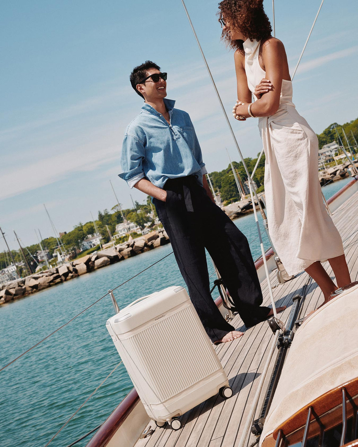 a man and woman standing on a boat