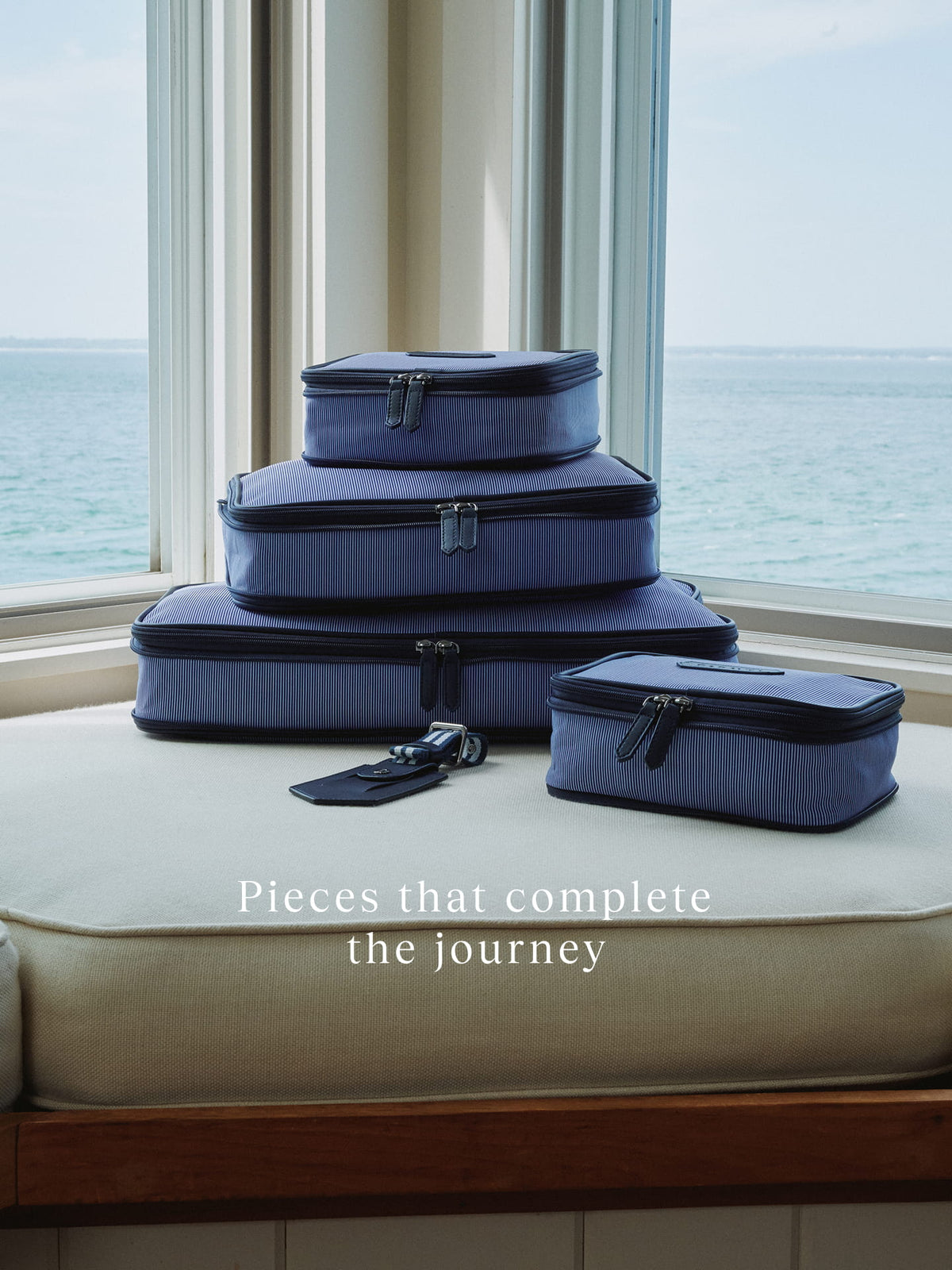 a stack of luggage on a cushion