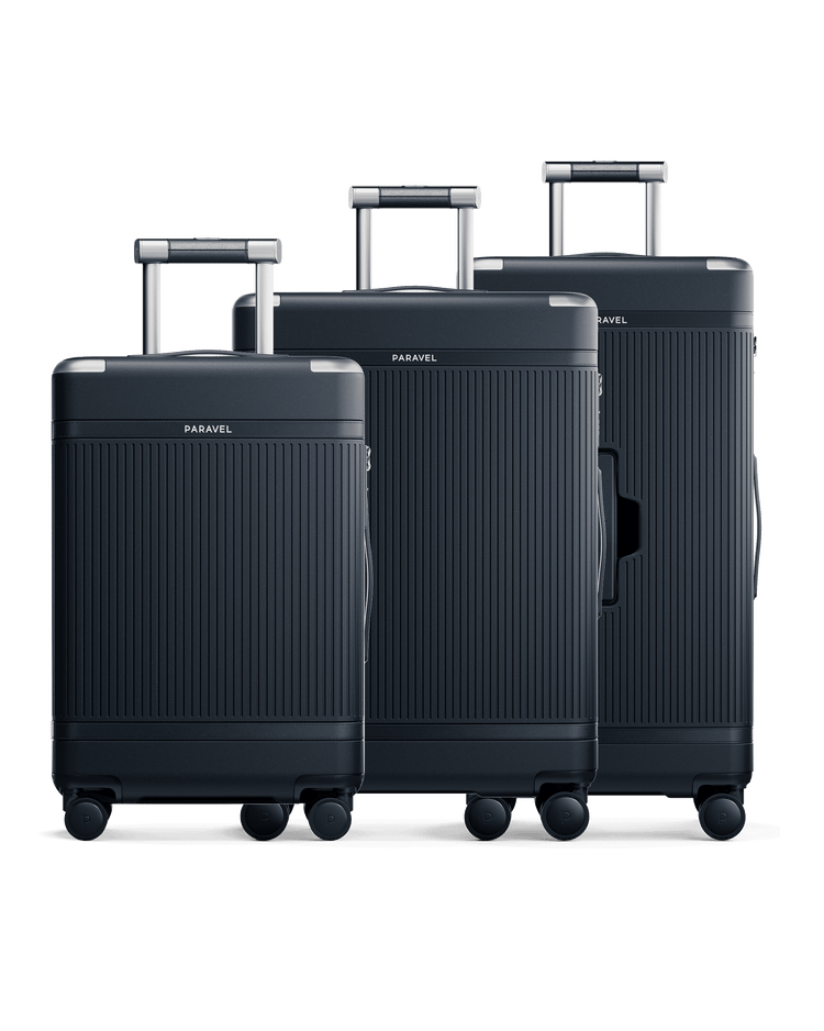 a group of luggage on wheels